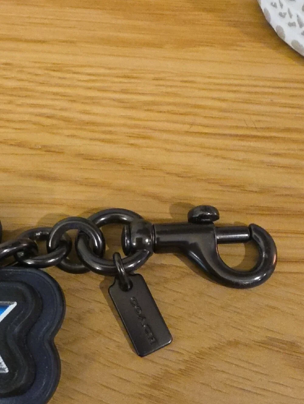 Coach Black Logo Keychain with Blue-Pink Gradient Lettering